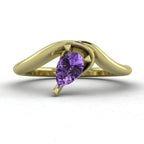 Enchanted pear-shaped violet sapphire asymmetrical solitaire engagement ring front view — ethereal lavender sapphire in sculptural recycled 18ct yellow gold band by Nude Jewellery