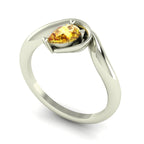 Enchanted pear-shaped yellow sapphire asymmetrical solitaire engagement ring three-quarter view — sculptural organic band in recycled 18ct white gold by Nude Jewellery