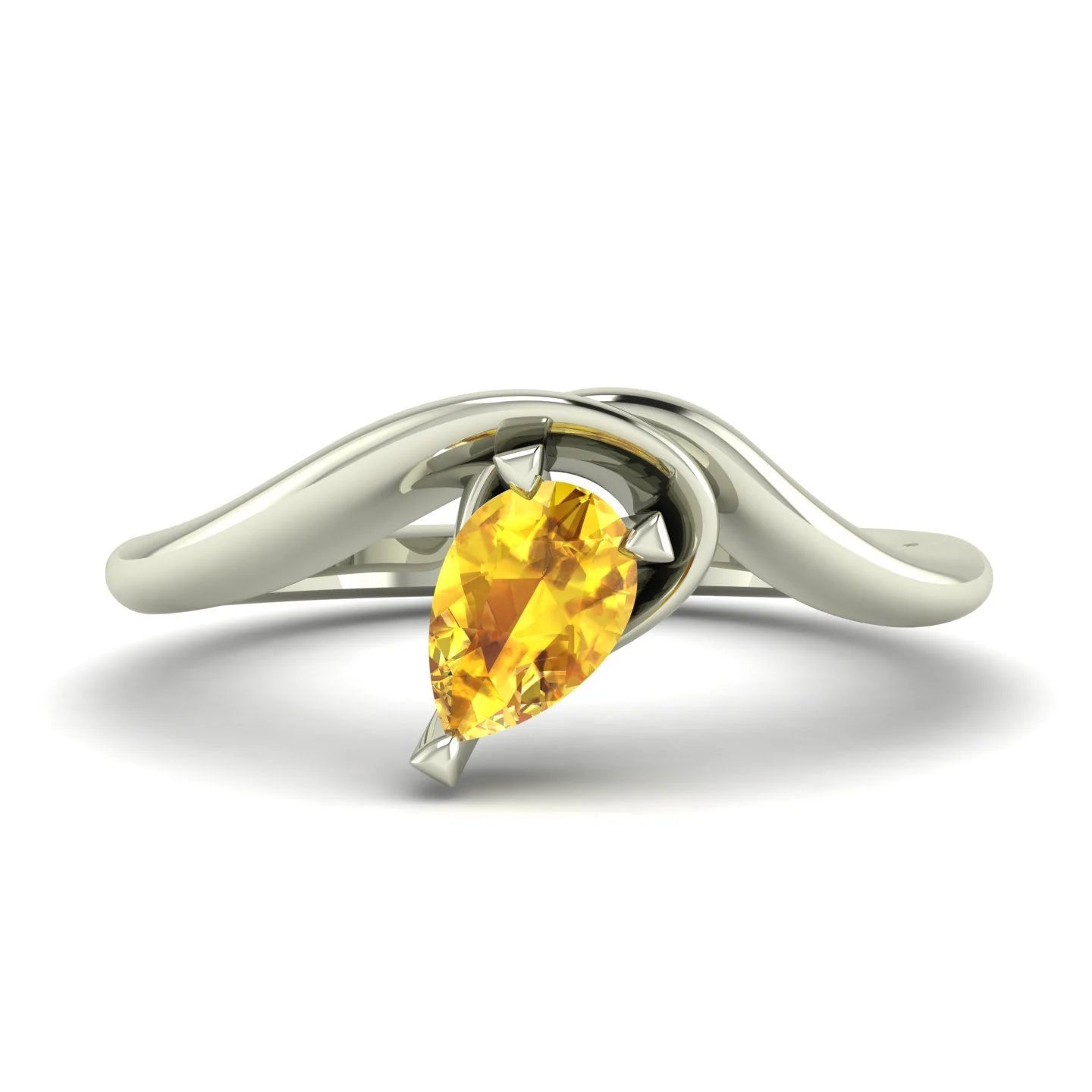 Enchanted pear-shaped yellow sapphire asymmetrical solitaire engagement ring top-down view — showing asymmetric setting and pear stone orientation in white gold by Nude Jewellery