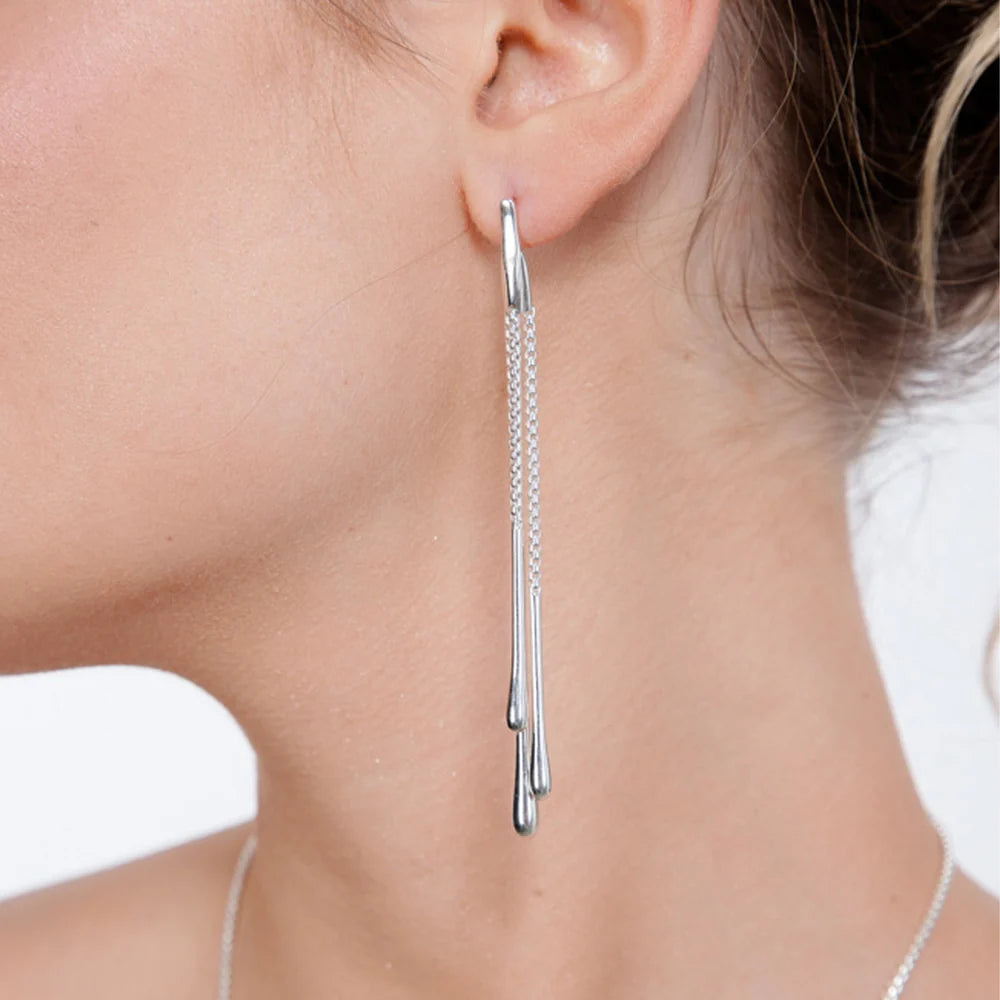 Multi Drip drop earrings in silver — model wearing long chain and bar drop earrings 
