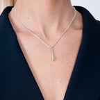 Short Single Drop Pendant in sterling silver — model close-up showing elongated droplet pendant on snake chain