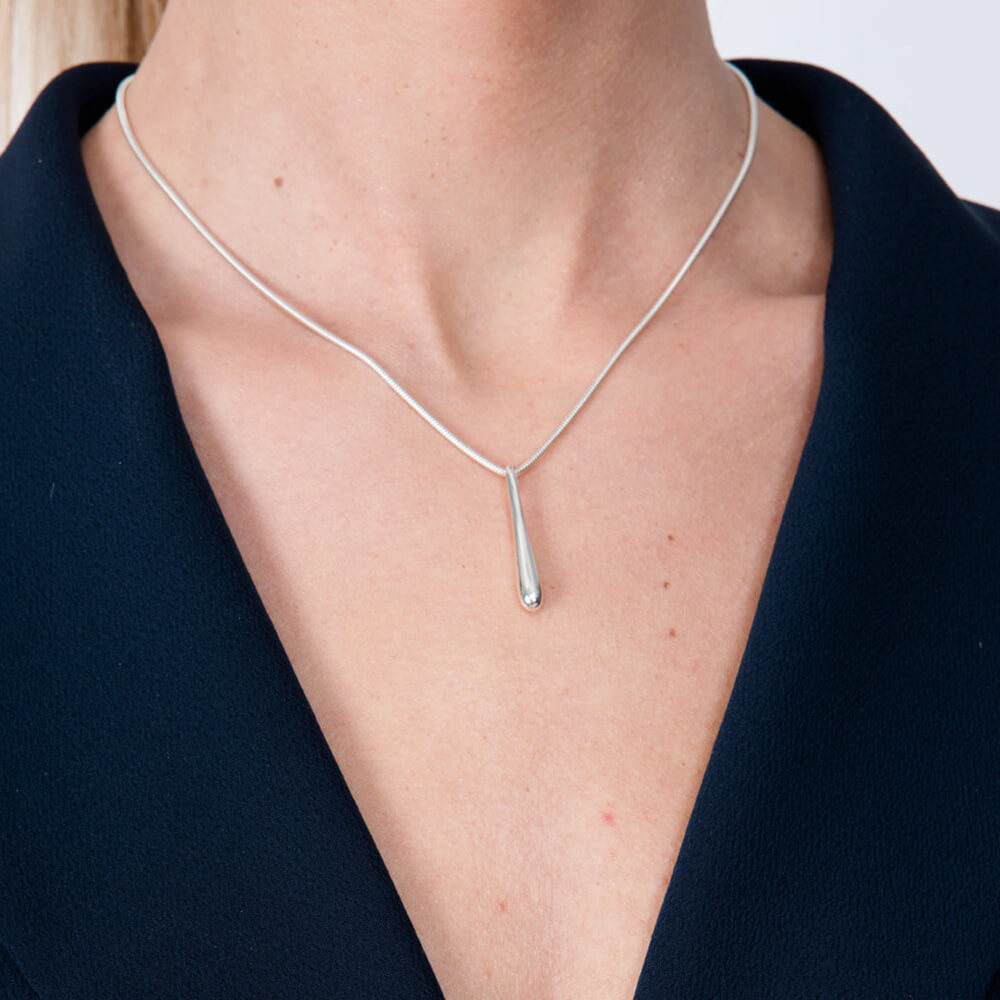 Short Single Drop Pendant in sterling silver — model close-up showing elongated droplet pendant on snake chain