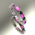 Handmade white gold eternity ring with pink sapphires and black diamonds