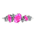 Front view of the 18ct rose gold Atlantis Paradise ring featuring a central pink sapphire and an asymmetrical cluster of sparkling diamonds.