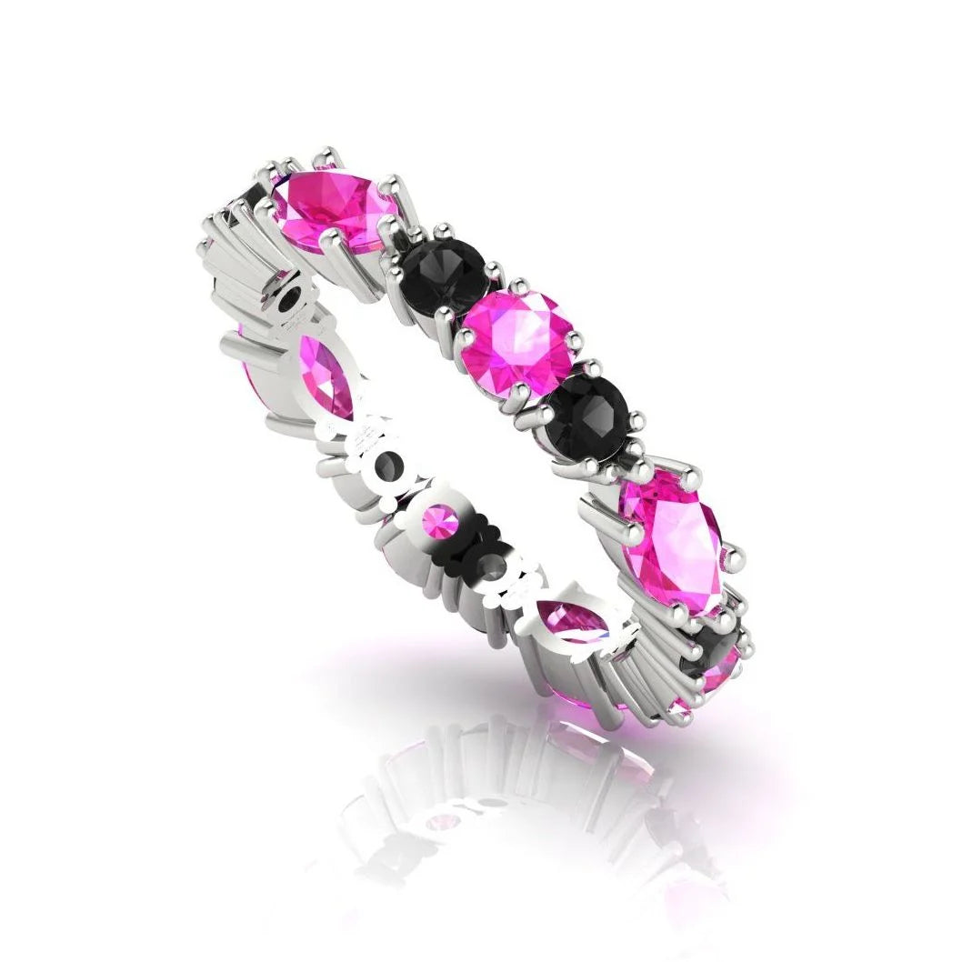 Close-up of the hand-finished settings on a pink sapphire and black diamond ring