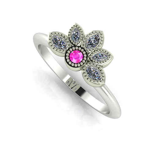 Angled perspective of a pink sapphire and diamond cluster ring in white gold featuring fine milgrain textured edges.