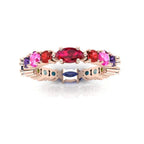 Close-up of the Allsorts eternity ring showcasing the warm-toned pink sapphires and crimson rubies for a striking and edgy colour combination