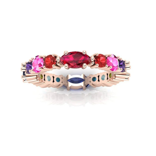 Close-up of the Allsorts eternity ring showcasing the warm-toned pink sapphires and crimson rubies for a striking and edgy colour combination
