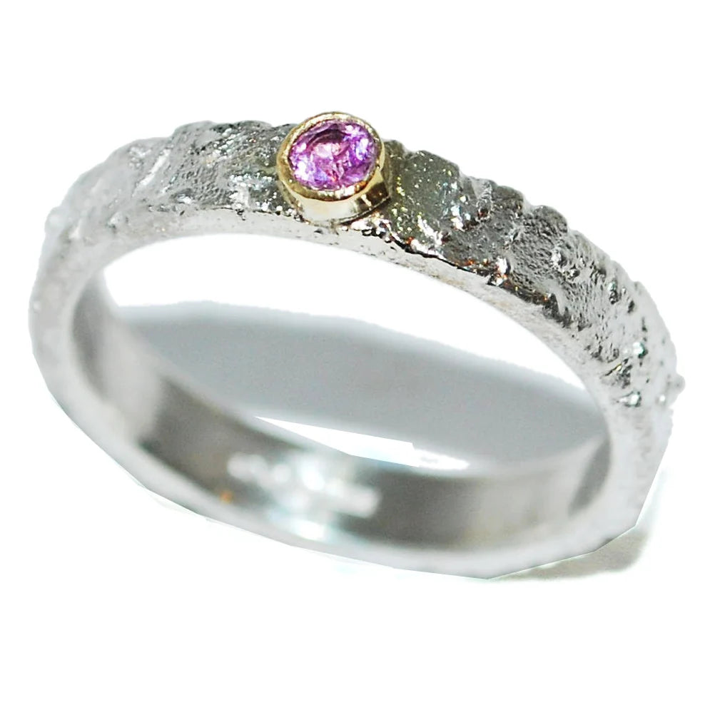 Rivda pink sapphire ring in sterling silver with 9ct gold setting on white background