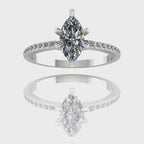 A 360-degree video of the Amoret lab-grown diamond engagement ring in white gold or platinum. The footage showcases the brilliant light return of the sustainable marquise diamond and the pavé-set shoulder diamonds against the cool-toned, high-polish band.