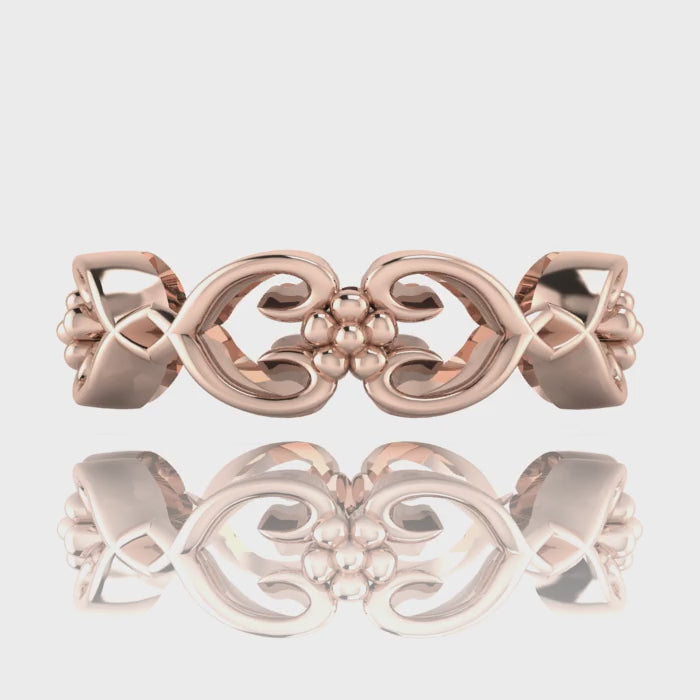 Video of Flowers On The Vine floral wedding ring in 18ct rose gold, rotating to show sculptural vine and blossom detail, handmade by Nude Jewellery London