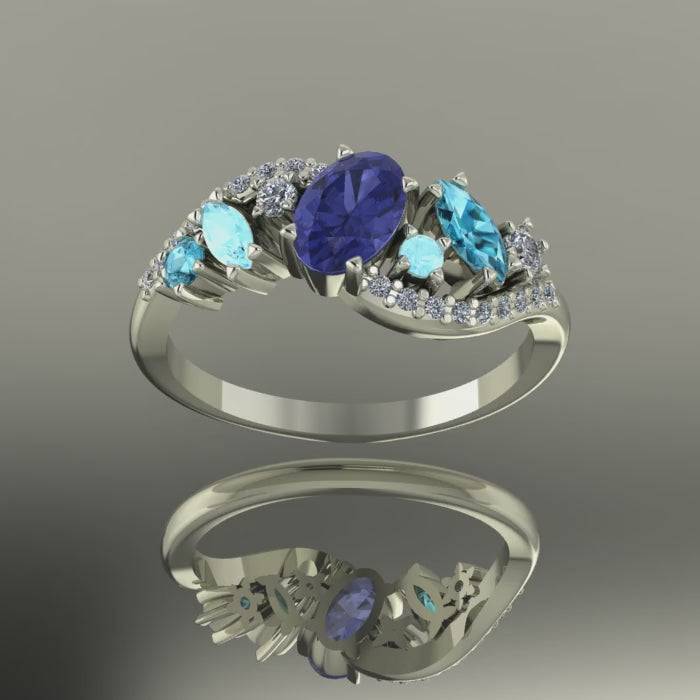 Video of the Atlantis Storm ring in 18ct white gold, featuring a central tanzanite accented by blue zircons, aquamarines, and diamonds.