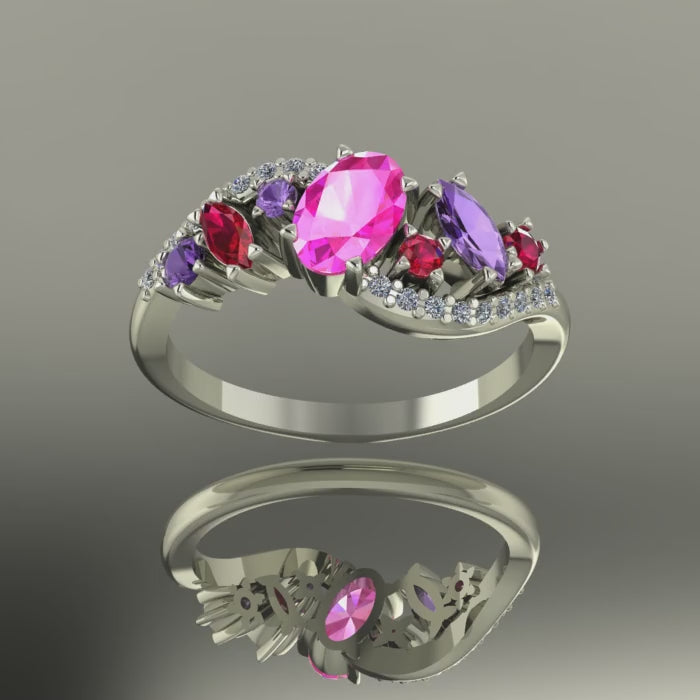 Video showcase of the Atlantis Storm ring featuring vibrant pink sapphires and rubies sparkling in 18ct white gold.
