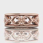 Video of Flowers On The Vine floral wedding ring in 18ct rose gold, rotating to show sculptural vine and blossom detail, handmade by Nude Jewellery London