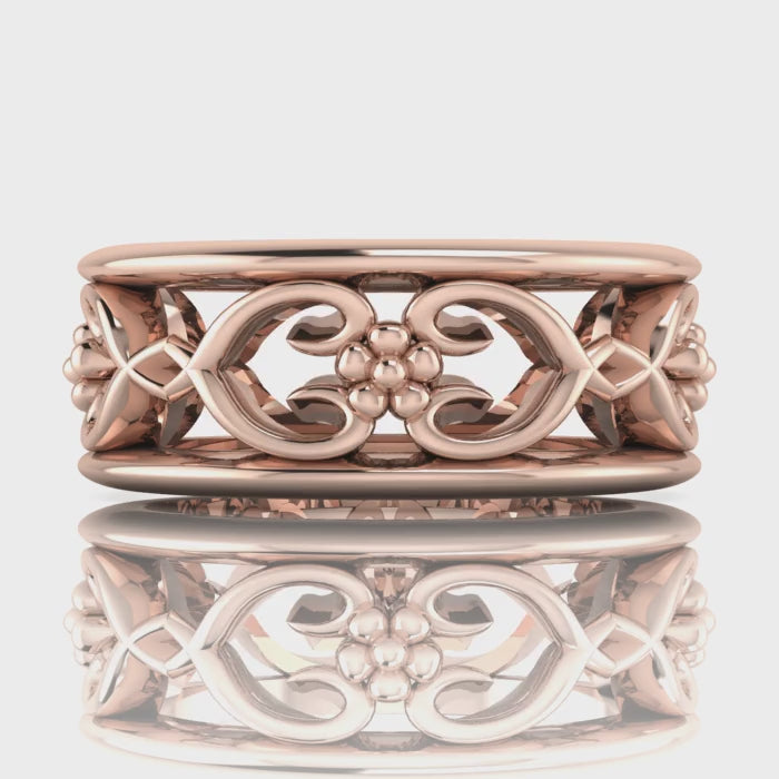 Video of Flowers On The Vine floral wedding ring in 18ct rose gold, rotating to show sculptural vine and blossom detail, handmade by Nude Jewellery London