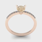Calista pear shaped champagne diamond engagement ring in 18ct rose gold, studio video showing the warm honeyed champagne stone and white diamond pavé band, handmade in our London studio
