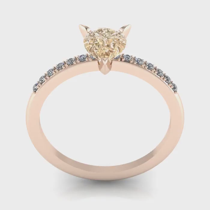 Calista pear shaped champagne diamond engagement ring in 18ct rose gold, studio video showing the warm honeyed champagne stone and white diamond pavé band, handmade in our London studio