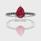 Video of the Calista ruby ring, capturing the deep crimson colour of the pear centre stone and its contrasting pavé black diamond shoulders.