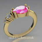 Comet Ring: Pear Shaped Pink Sapphire & Diamonds Asymmetrical Trilogy Ring