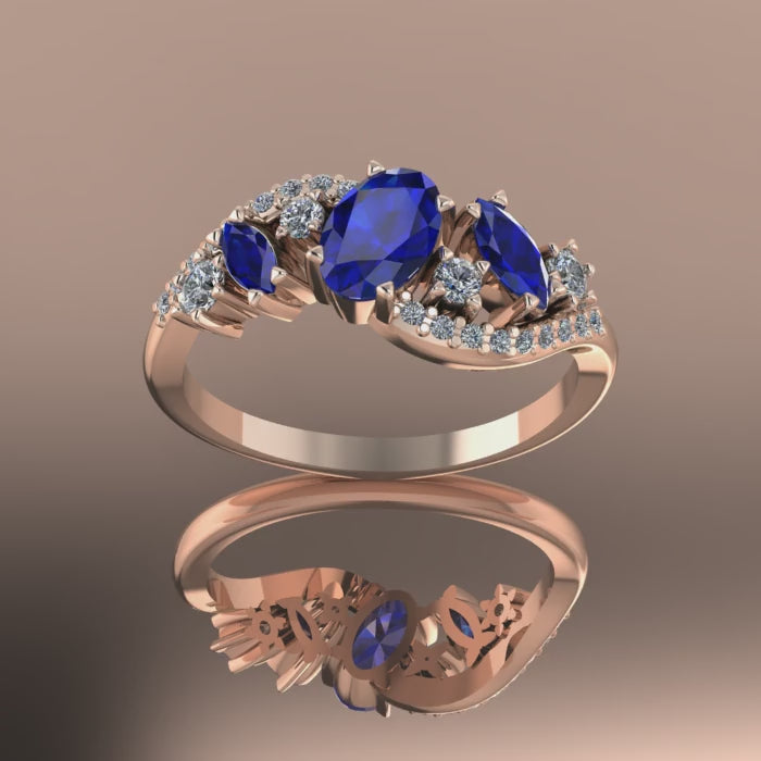 Video of the Atlantis Storm ring in 18ct rose gold, capturing the contrast of deep blue sapphires and brilliant white diamonds.