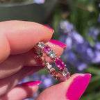 A 360-degree video of the Fire and Ice eternity ring in 18ct rose gold. The footage shows the sun light catching the pale blue marquise-cut aquamarines and vibrant pink brilliant-cut sapphires as the band rotates, highlighting the rhythmic, architectural cluster and the warm glow of the rose gold.