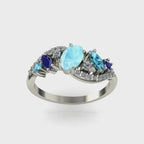 Movie of the angled view of the Atlantis Storm ring highlighting the cluster of blue aquamarine and pavé set diamonds.