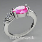 Comet Ring: Pear Shaped Pink Sapphire & Diamond Horizontally Set Trilogy Ring