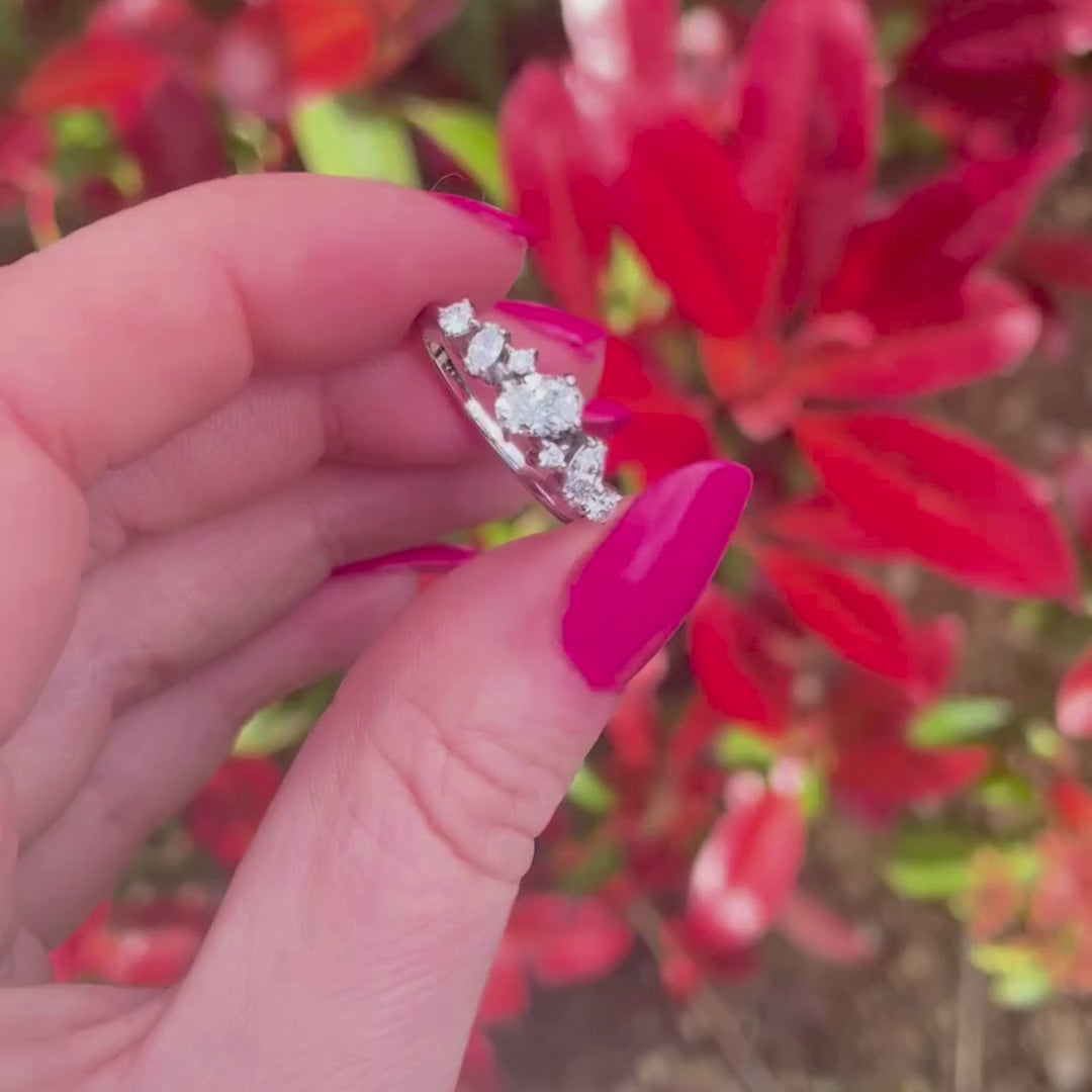 Video of the Atlantis Paradise diamond asymmetric cluster engagement ring in 18ct recycled white gold, featuring oval, marquise and round brilliant-cut diamonds — handmade in London by Nude Jewellery
