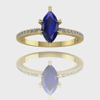 A 360-degree video of the Amoret engagement ring in 18ct yellow gold. The footage showcases the deep blue hues of the central marquise sapphire and the brilliant sparkle of the diamond-set shoulders against the rich golden band.