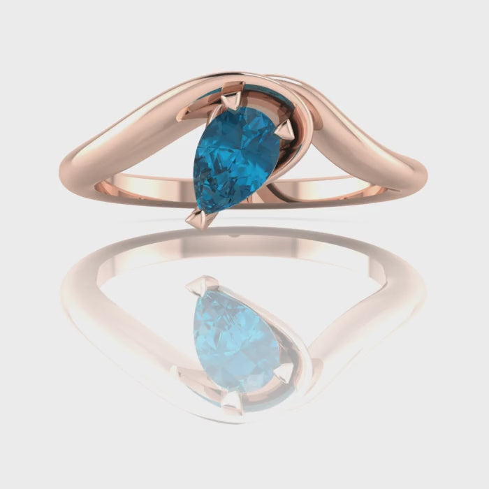 Enchanted Pear Shaped London Blue Topaz Asymmetrical Solitaire Engagement Ring in 18ct Rose Gold