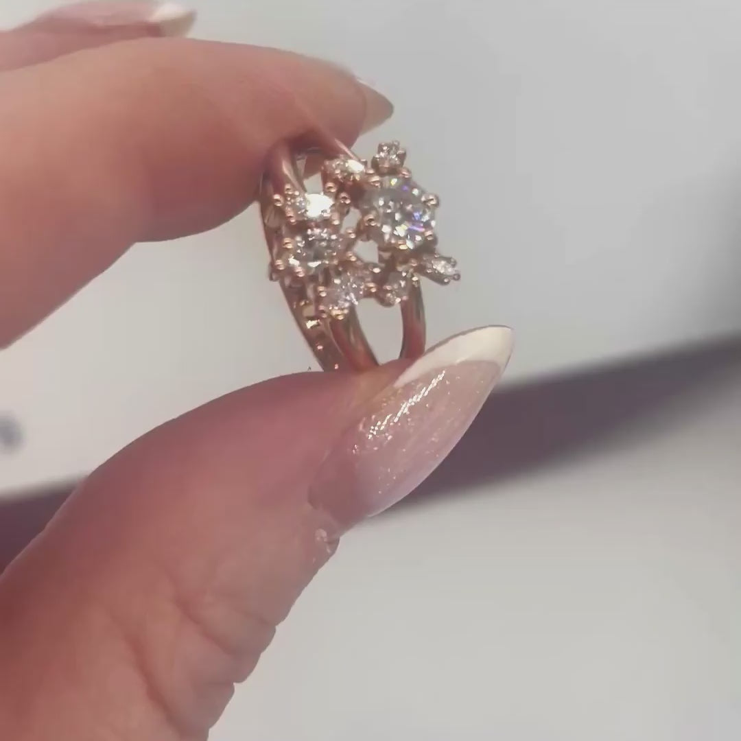 Flutterby diamond butterfly cluster ring in rose gold, styled with matching wedding band, rotating studio video showing the diamond cluster detail and stacked ring pairing, handmade in our London studio