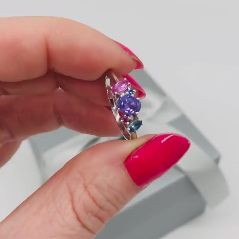 Atlantis violet, pink and blue sapphire asymmetrical engagement ring in platinum or 18ct white gold, rotating 360° studio video showing the organic multi-sapphire cluster and sculptural setting, handmade in our London studio
