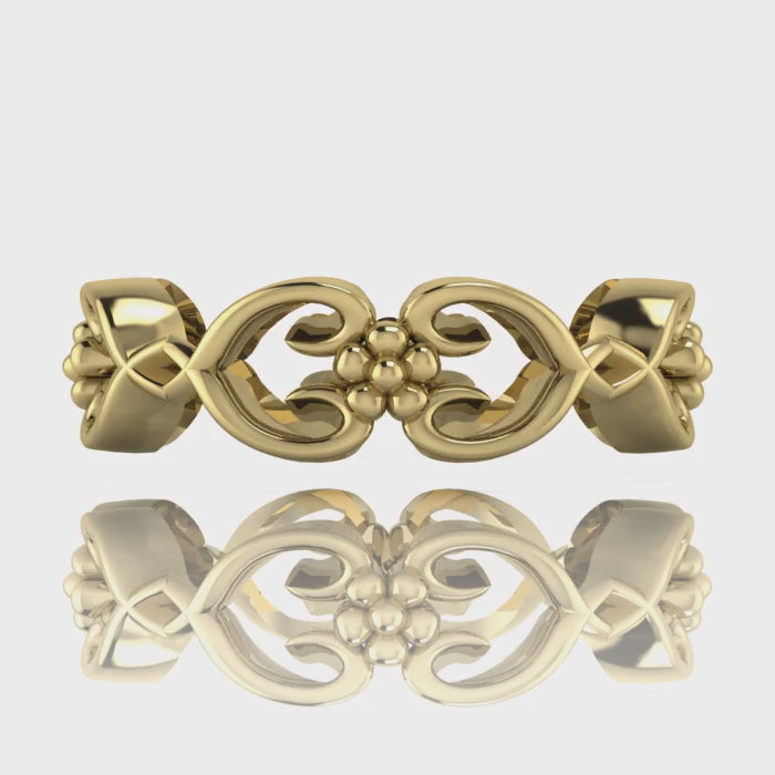 Video of Flowers On The Vine floral wedding ring in 18ct yellow gold, rotating to show sculptural vine and blossom detail, handmade by Nude Jewellery London