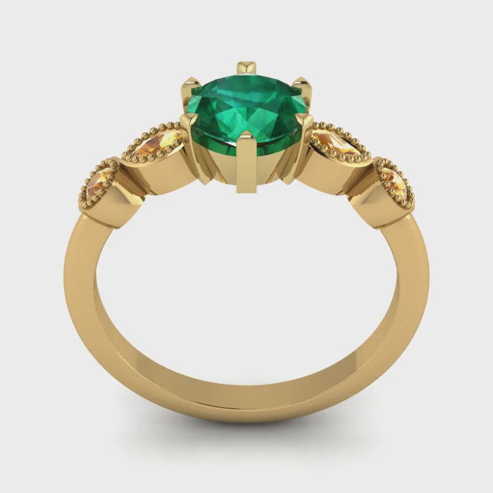 Video of the Milena emerald and yellow sapphire five-stone engagement ring, handmade in London by Nude Jewellery