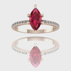 A 360-degree video of the Amoret ruby engagement ring in 18ct rose gold. The footage captures the deep crimson facets of the marquise ruby and the shimmering diamond-set shoulders as the band rotates.