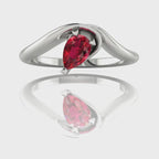 Enchanted pear shaped ruby asymmetric solitaire engagement ring in white gold, rotating 360 view showing sculptural band and vivid red ruby