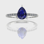 Video of the Calista blue sapphire ring, capturing the velvety midnight-blue shimmer of the pear centre stone and its sparkling white diamond shoulders.