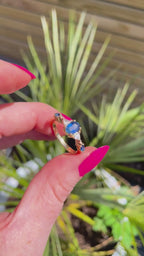 Maisie oval blue sapphire and diamond engagement ring in 18ct yellow gold, rotating 360° studio video showing the vivid blue sapphire and diamond shoulders, handmade in our London studio