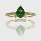 Video of the Calista green tourmaline ring in 18ct yellow gold, capturing the deep forest-green shimmer of the pear centre stone and its brilliant white diamond shoulders.