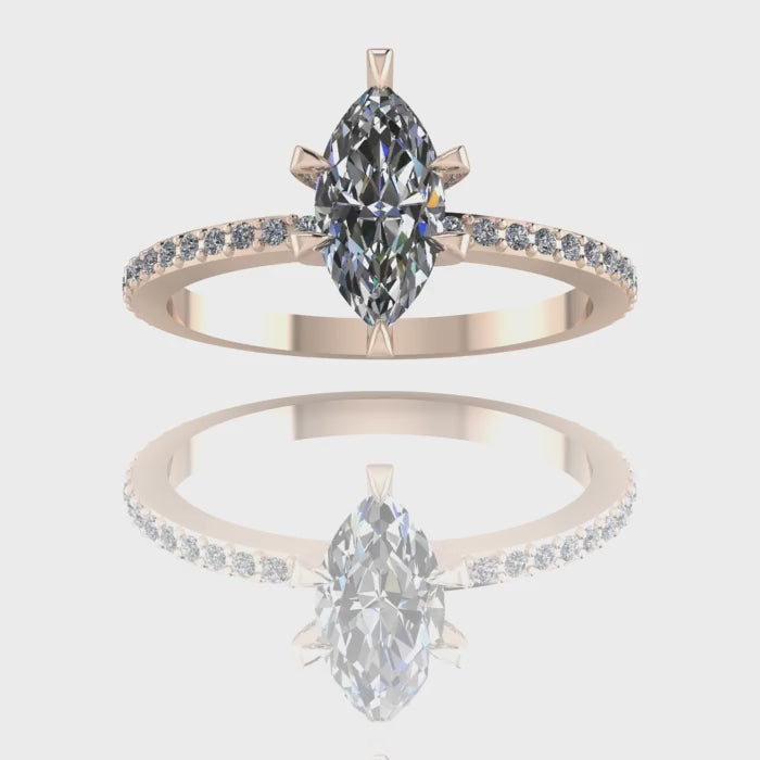 A 360-degree video of the Amoret lab-grown diamond engagement ring in 18ct rose gold. The footage highlights the exceptional brilliance of the sustainable marquise-cut diamond and the pavé-set shoulder diamonds as the band rotates.