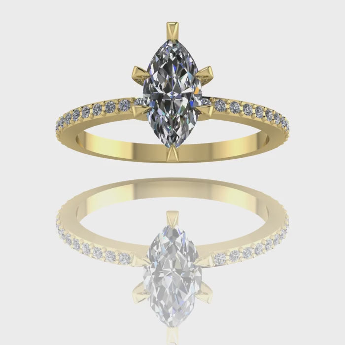A 360-degree video of the Amoret lab-grown diamond engagement ring in 18ct yellow gold. The footage highlights the exceptional brilliance of the sustainable marquise-cut diamond and the pavé-set shoulder diamonds against the high-polish golden band.
