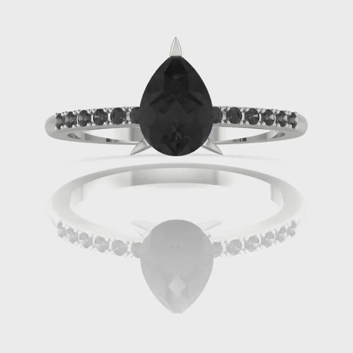 Video of the Calista ring, highlighting the brilliant white accent diamonds framing the central black pear diamond.