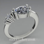 Comet Ring: Pear Shaped Lab Grown Diamonds Horizontally Set Trilogy Ring