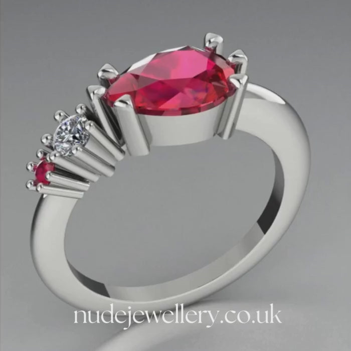 Pear shaped ruby, diamond and ruby accent asymmetrical Comet engagement ring in 18ct white gold, 360 degree view
