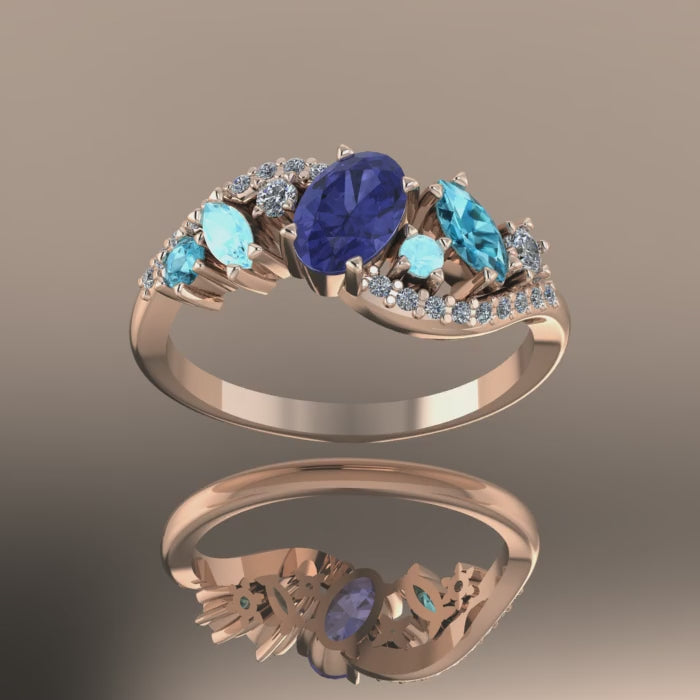 Video of the Atlantis Storm ring in 18ct rose gold, showing the deep violet tanzanite and rare blue diamonds sparkling in the light.