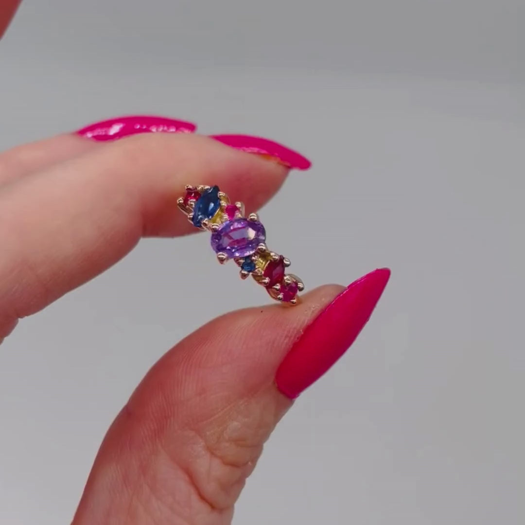 Video of the Atlantis Paradise asymmetrical cluster ring in 18ct recycled rose gold, featuring violet, pink and blue sapphires with rubies — handmade in London by Nude Jewellery