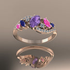 Close-up video of the Atlantis Storm ring in 18ct rose gold, showing the light reflecting through violet, blue, and pink sapphires and diamonds.