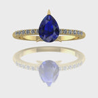 Video of the Calista blue sapphire ring in 18ct yellow gold, capturing the velvety midnight-blue shimmer of the pear centre stone and its sparkling white diamond shoulders.