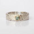 Rivda princess-cut pale blue sapphire ring in sterling silver with 9ct gold setting on white background — front view