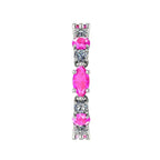 Side profile of the pink sapphire and diamond eternity band showing the delicate white gold claw settings.